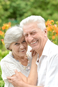 elderly couple smiling